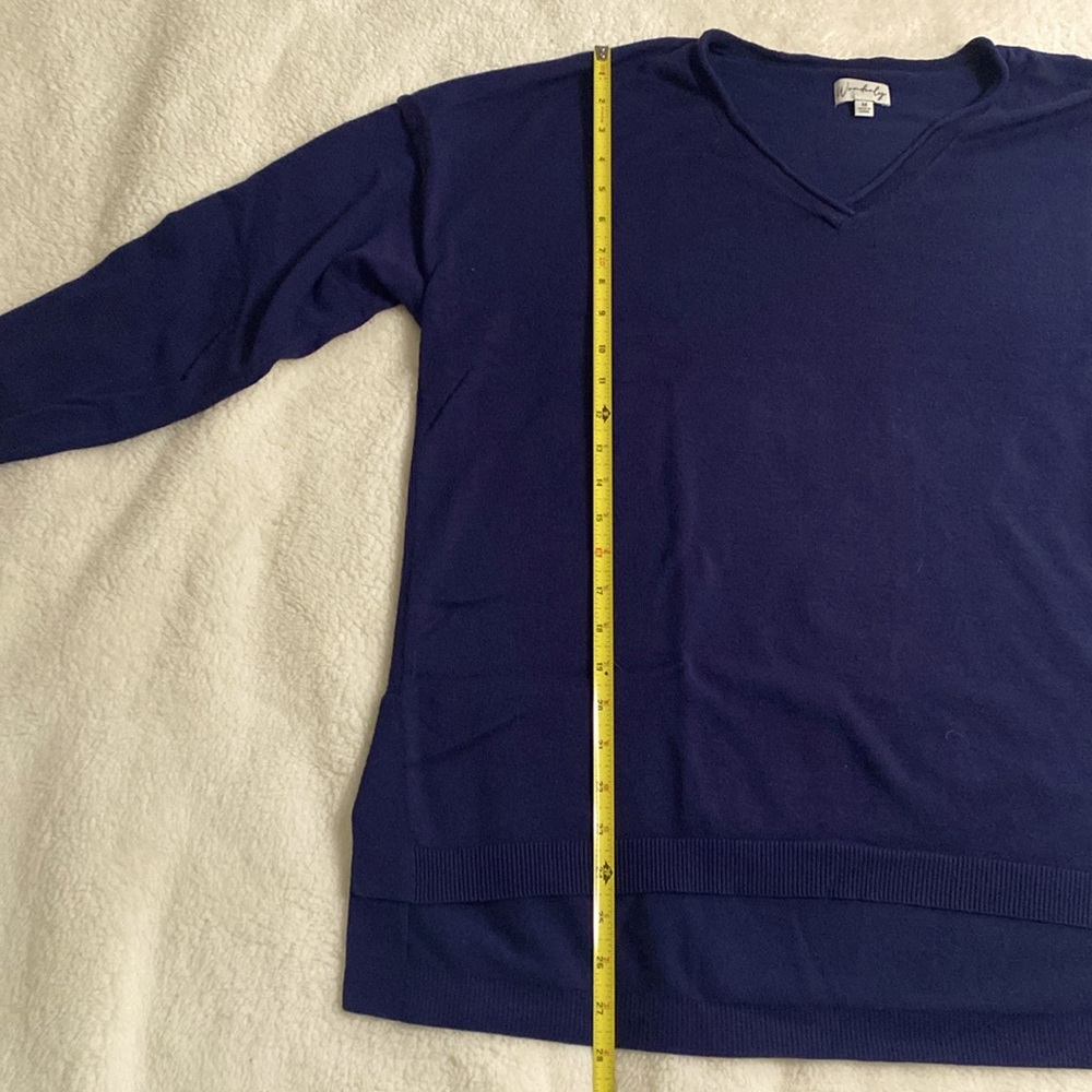 V-neck navy blue Wonderly sweater with high-low hem.  Medium.
